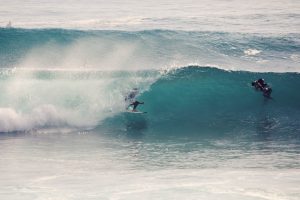 Advanced surfer riding inside a barrel wave in Ericeira, Portugal, captured during a Surf Guiding session by Moka Surf House.