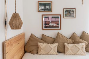 Detail of the Ensuite Double Room at Moka Surf House with natural-style decor and framed photography on the wall.